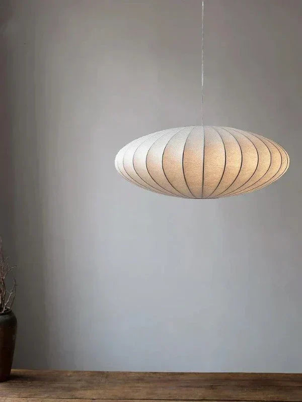 Elegant SilkCrown crystal pendant lamp, luxurious modern ceiling light for ambient home decor.