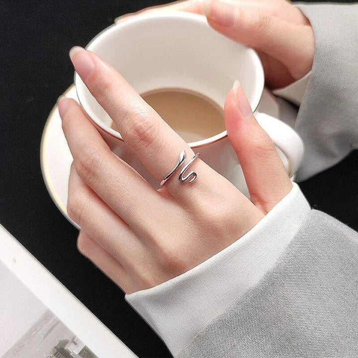 Elegant silver adjustable snake ring for women, symbolizing transformation and rebirth. Perfect fashion accessory.