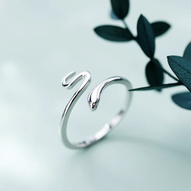 Stylish women's adjustable snake ring in silver. Symbolizes transformation, rebirth, and growth. Unique fashion jewelry.