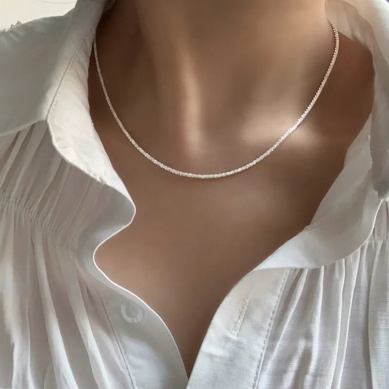 Dainty sterling silver choker necklace for women. Elegant collarbone jewelry, minimalist design for fashion.