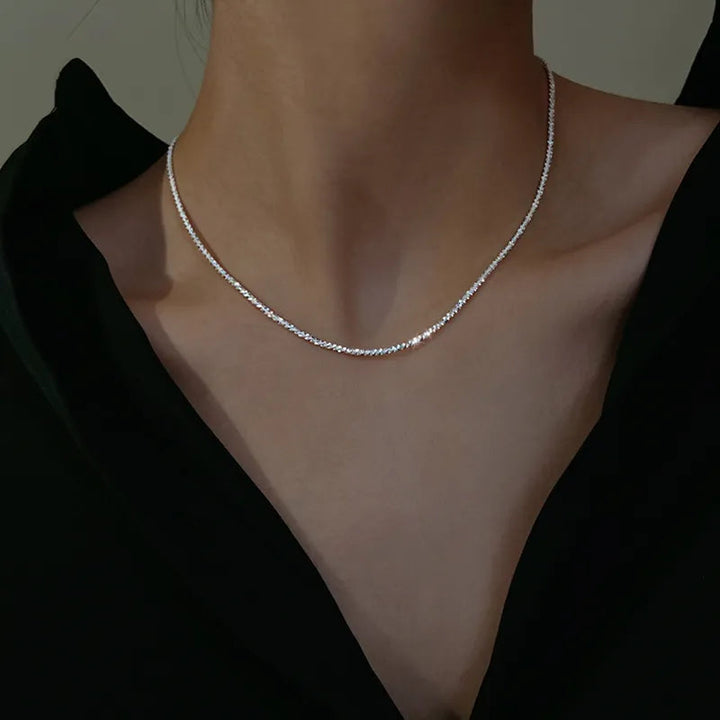 Elegant silver collarbone necklace, a stylish choker for women. Dainty sterling silver jewelry for any occasion.