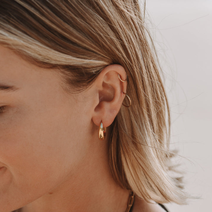 Shimmering silver-tone droplet earrings, elegant and lightweight, enhancing women's effortless style.