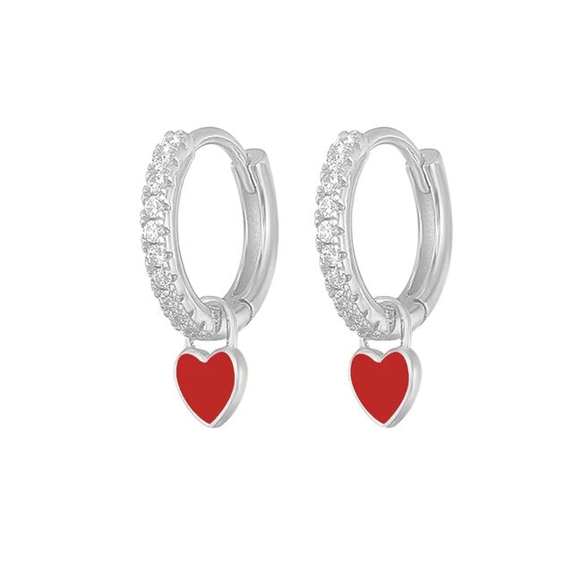 Polished silver fashion earrings, elegant hoop style for women.