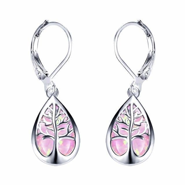 Shimmering opal gemstone set in sterling silver Tree of Life dangle earrings for women. Elegant & nature-inspired jewelry.
