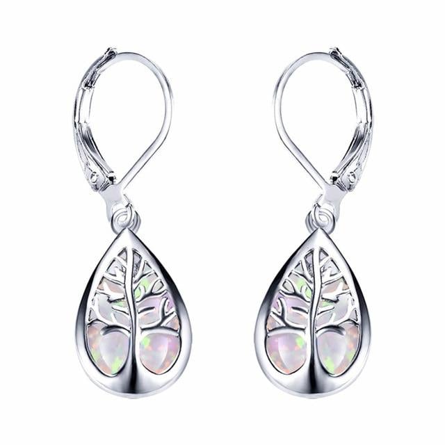 Women's silver Tree of Life dangle earrings with shimmering opal gemstones. Elegant, nature-inspired symbolic jewelry gift.