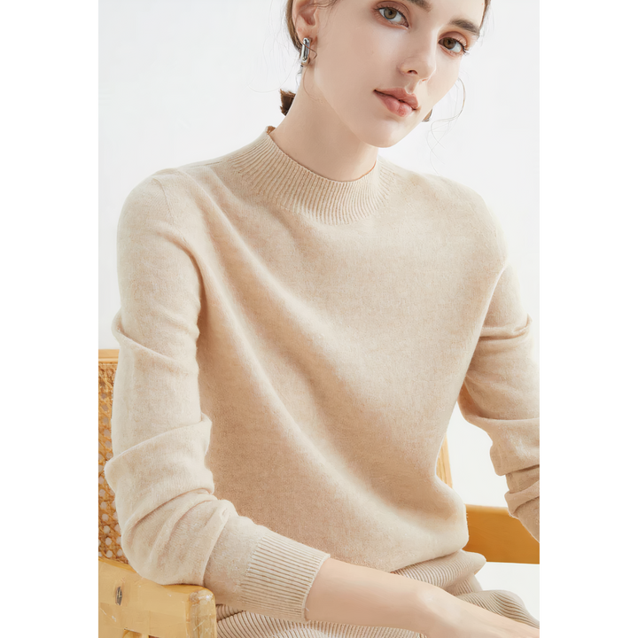 Model wearing a comfortable soft knit long sleeve women's pullover sweater for an elegant fall/winter look.
