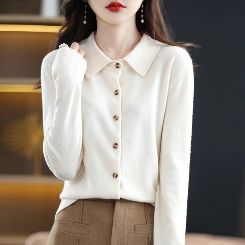 Women's elegant soft button-up top with long sleeves and collar. Versatile fashion apparel for work or casual looks.