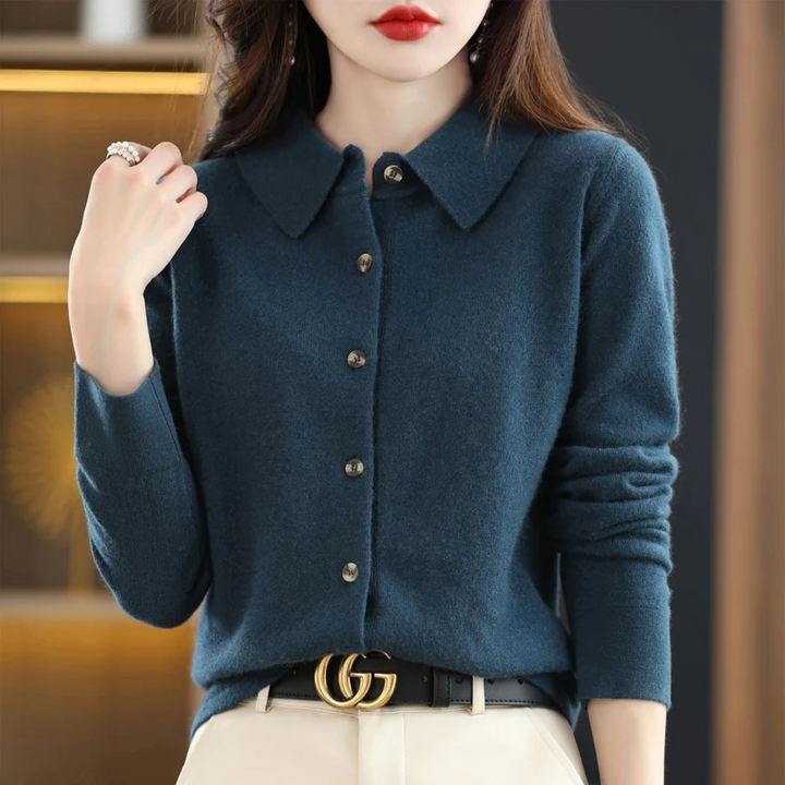 Soft women's long-sleeve button-up top, elegant and versatile for work or casual fashion. Comfortable collared design.