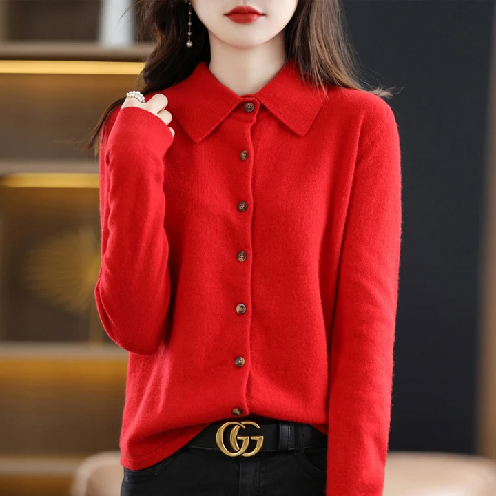 Fashionable women's soft button-up collared top. Elegant long-sleeve apparel for versatile casual and work styles.