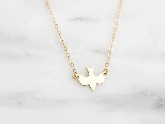 Delicate sterling silver bird pendant necklace for women. Elegant animal jewelry, perfect gift for her.
