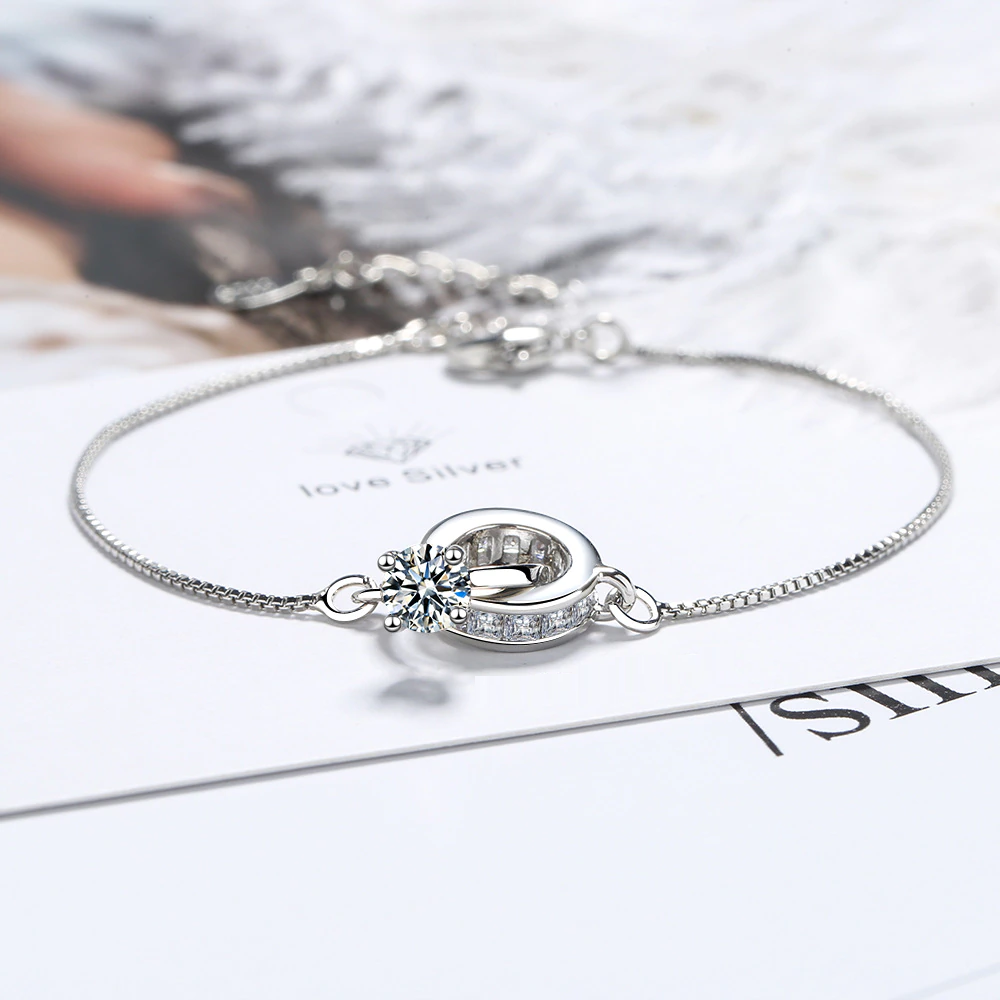 Women's elegant wedding bracelet featuring a delicate ring pendant in sterling silver. Versatile for any occasion.