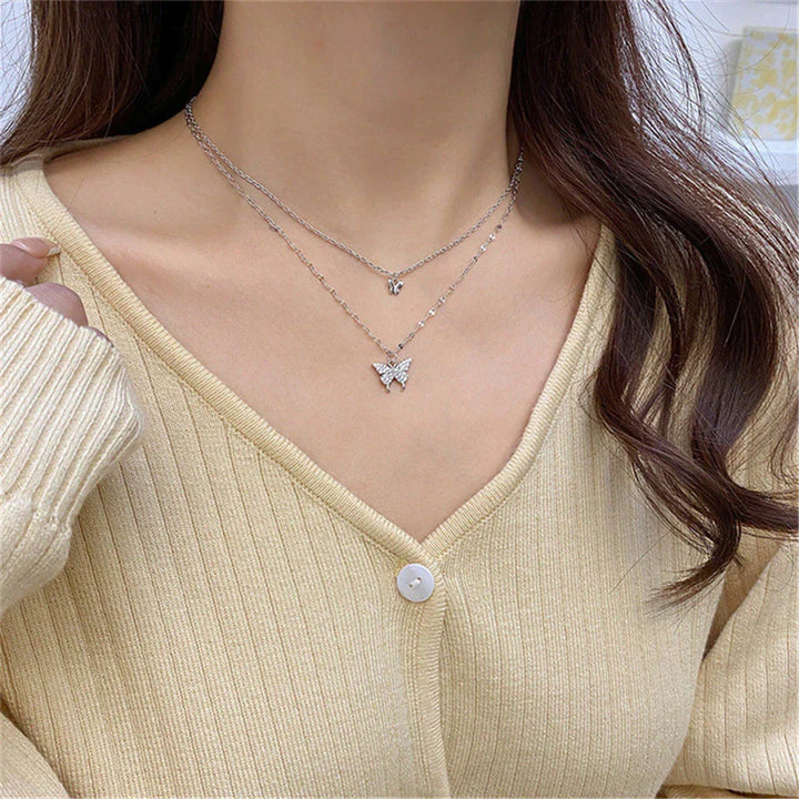 Shimmering silver butterfly necklace & earring set, a sophisticated jewelry gift for her.