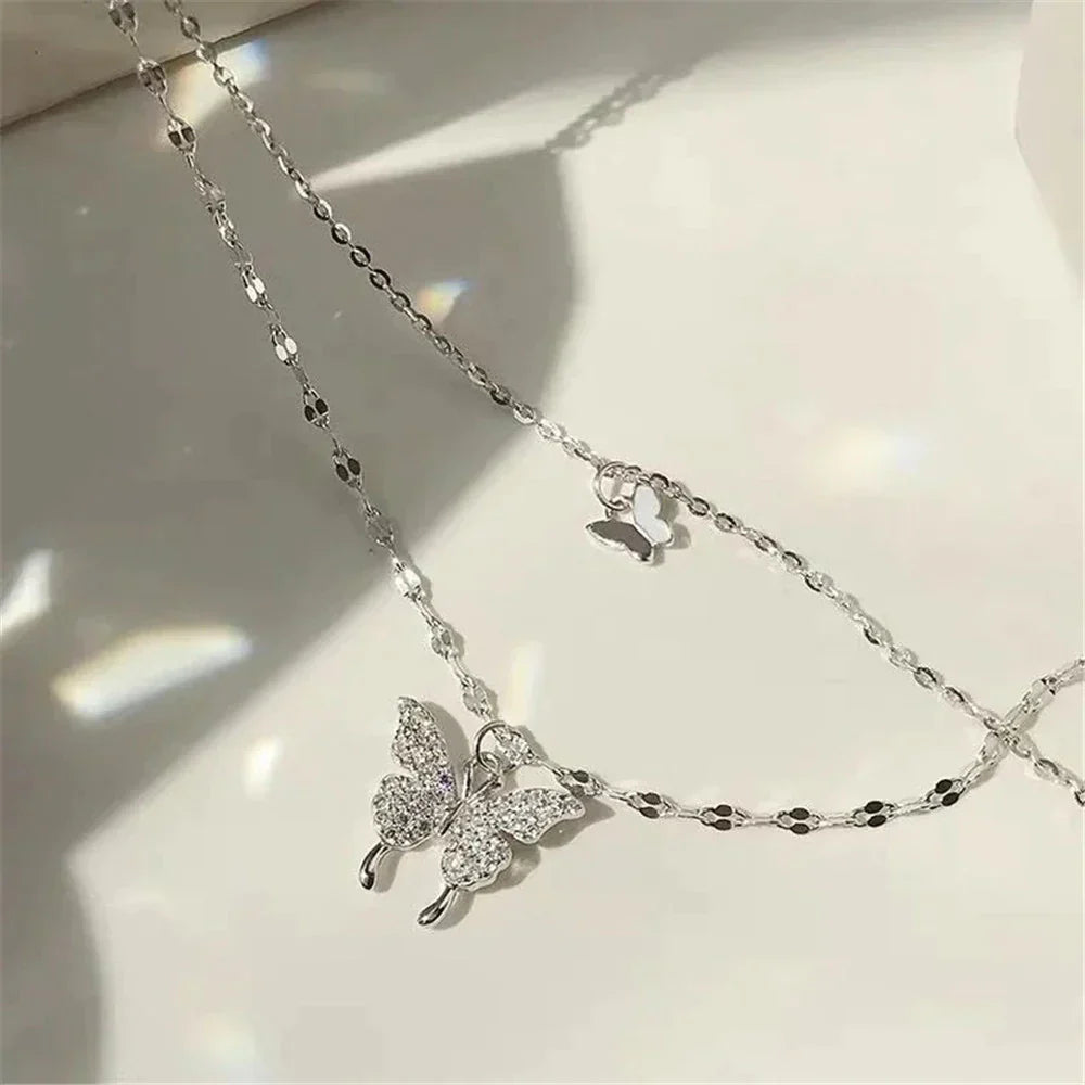 Close-up of a detailed sterling silver butterfly pendant with shimmering wings, elegant women's necklace.