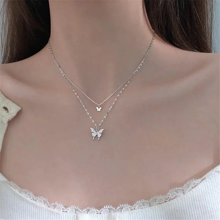Sophisticated sterling silver butterfly necklace set for women, with a delicate shimmering pendant.