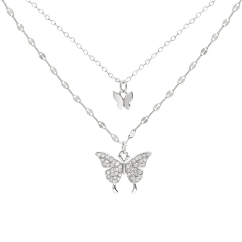 Fashionable women's silver butterfly necklace & matching earrings, an elegant jewelry set for any occasion.