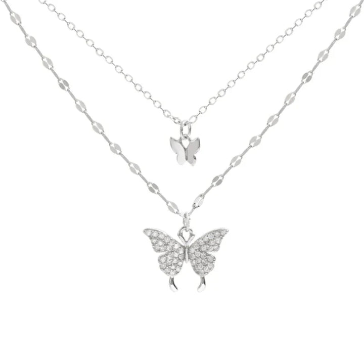 Fashionable women's silver butterfly necklace & matching earrings, an elegant jewelry set for any occasion.
