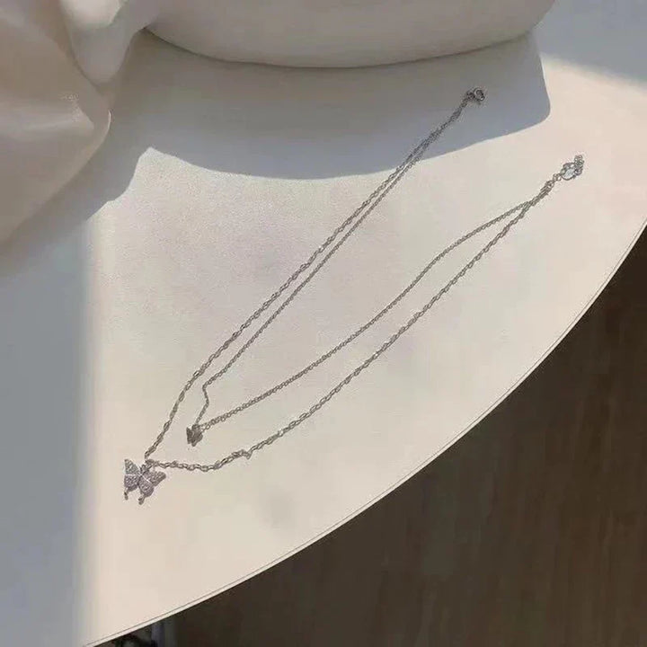 Delicate sterling silver butterfly necklace, a shimmering and elegant piece of women's fashion jewelry.