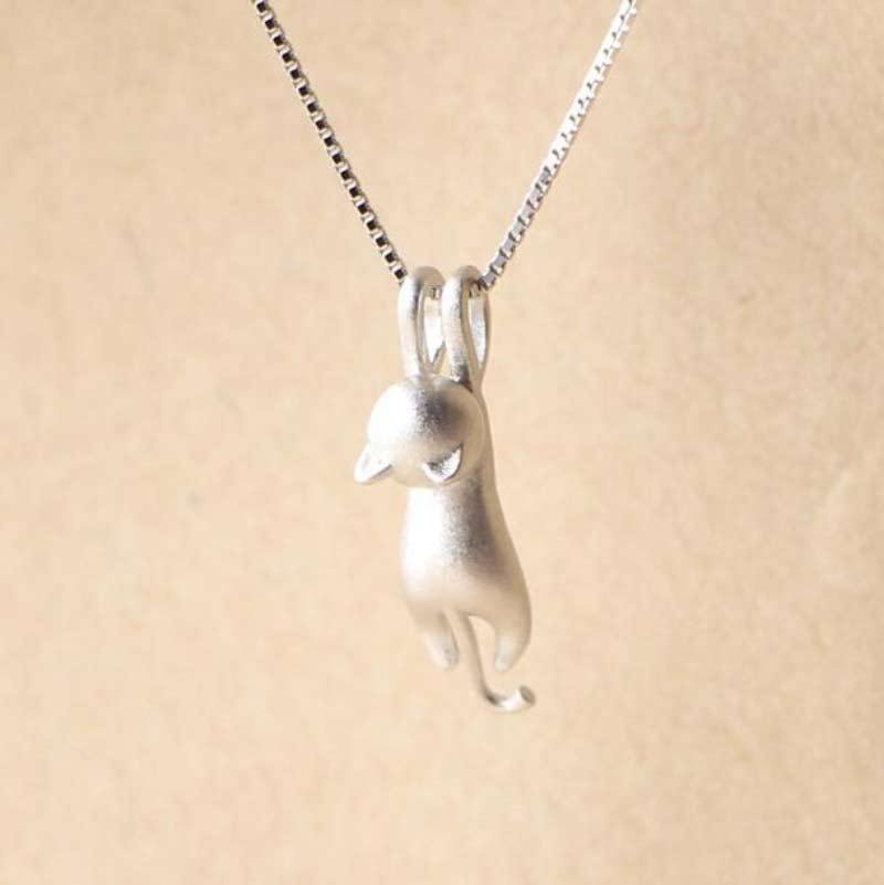Elegant sterling silver cat pendant necklace for women. Delicate feline jewelry, perfect for animal lovers.
