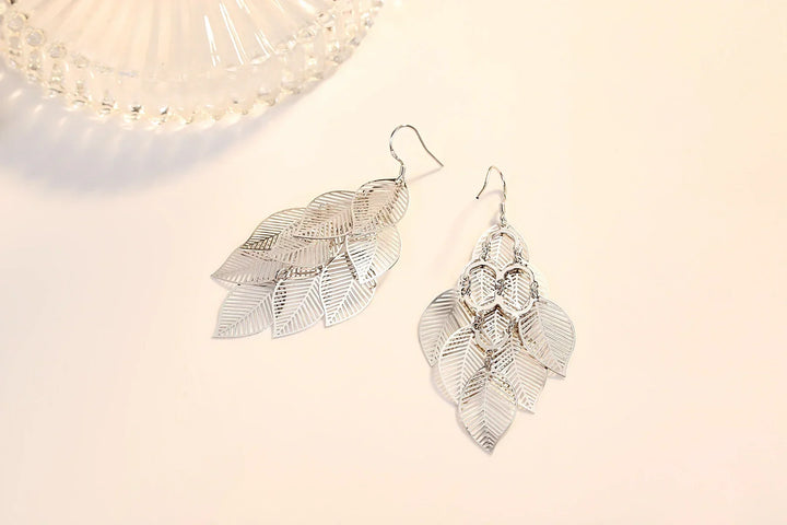 Gift for her: Delicate layered sterling silver leaf dangle earrings. Elegant, nature-inspired jewelry.