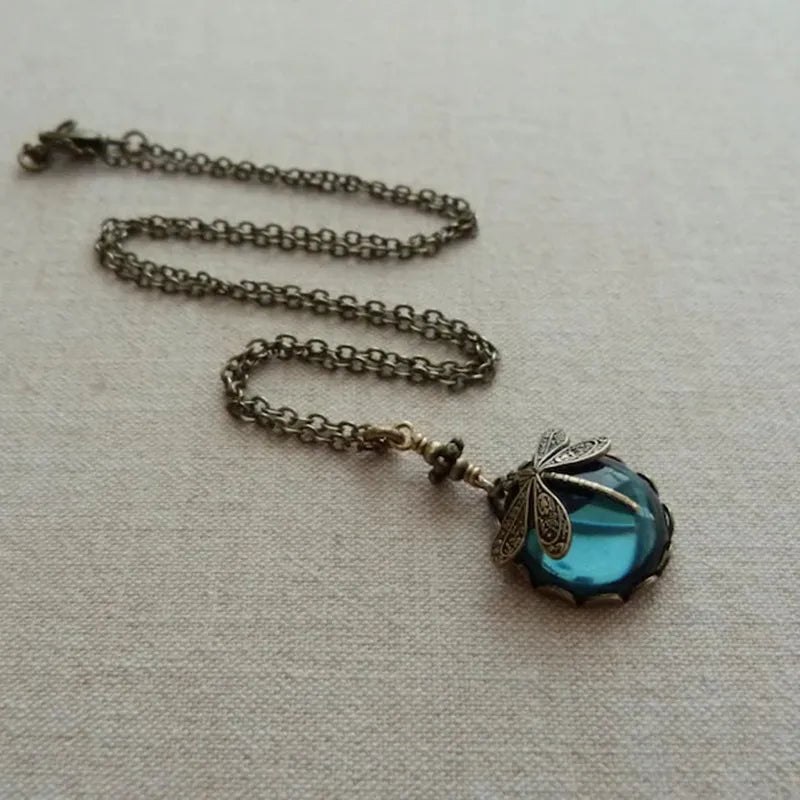 Dainty moonstone dragonfly necklace. Sterling silver gemstone jewelry for women, elegant and celestial style.