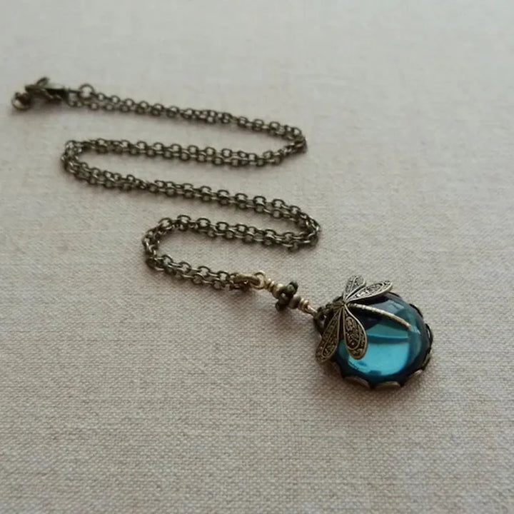 Dainty moonstone dragonfly necklace. Sterling silver gemstone jewelry for women, elegant and celestial style.