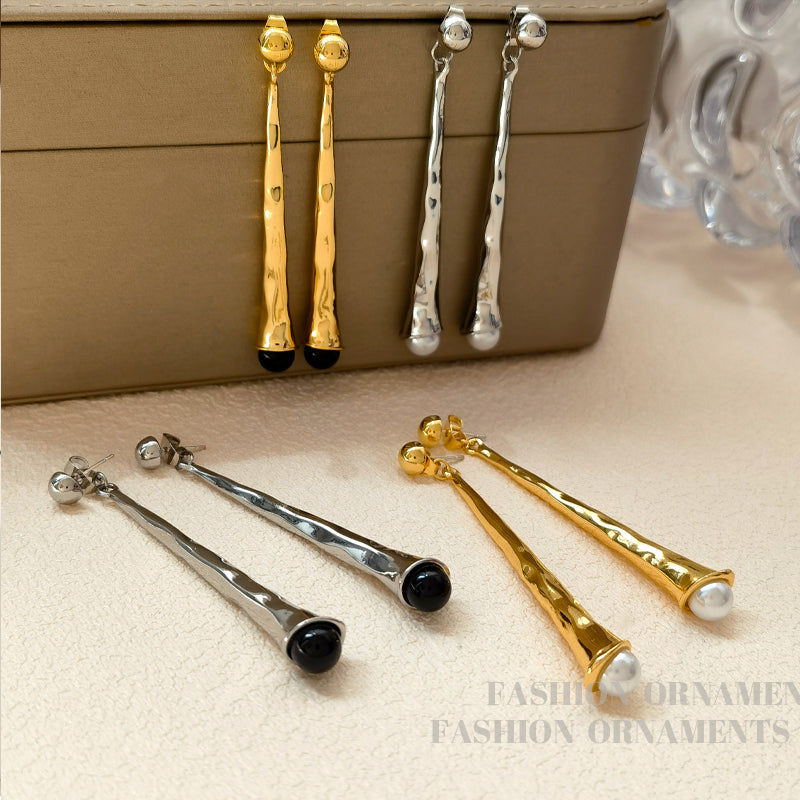 Women's elegant drop earrings, sterling silver, lightweight fashion accessory.