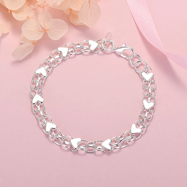 Women's classic sterling silver heart bracelet. Elegant and adjustable fine jewelry, an ideal silver accessory gift for her.