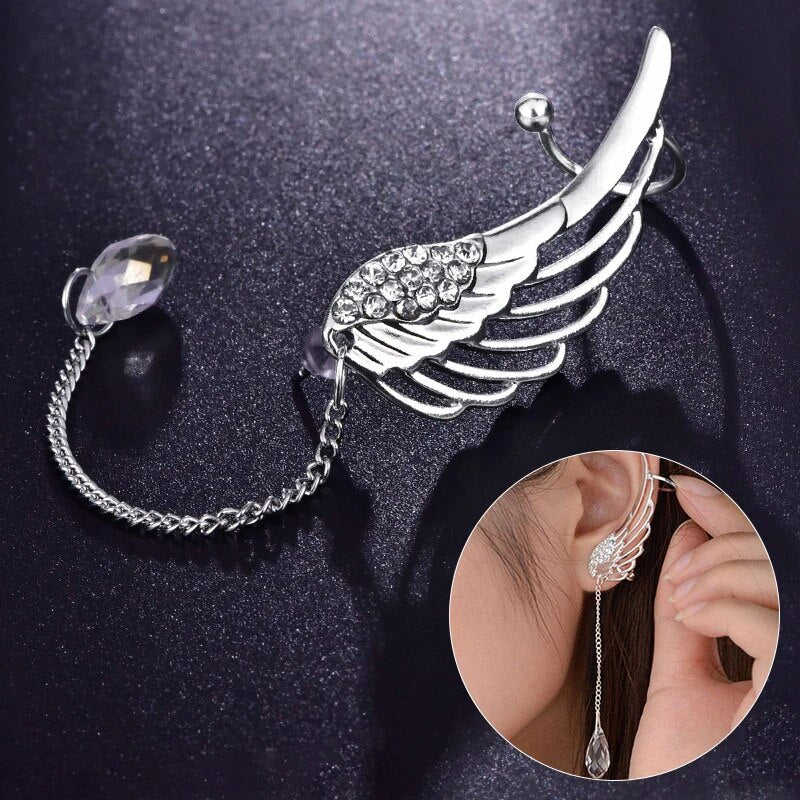 Elegant sterling silver long cuff earrings with delicate angel wings for women.