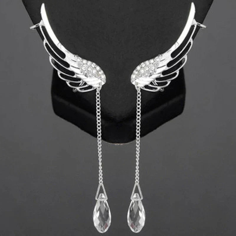 Women's elegant sterling silver long cuff earrings featuring intricate angel wings.