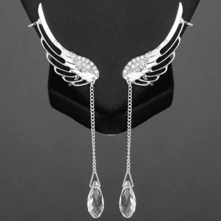 Women's elegant sterling silver long cuff earrings featuring intricate angel wings.