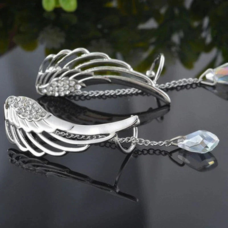Unique angel wing design long cuff earrings in sterling silver, elegant women's fashion jewelry.