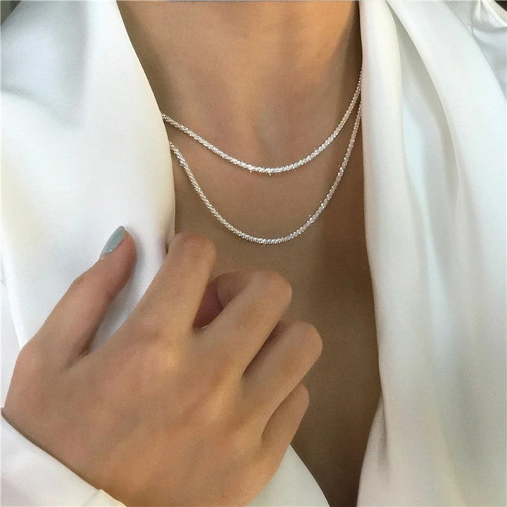 Elegant sterling silver starlight necklace and earring set for women, perfect for adding a touch of sparkle and shine.