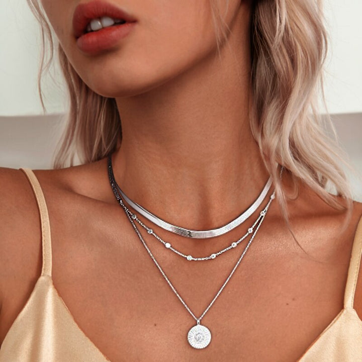 Elegant sterling silver triple chain necklace for women, perfect for fashion or a gift.