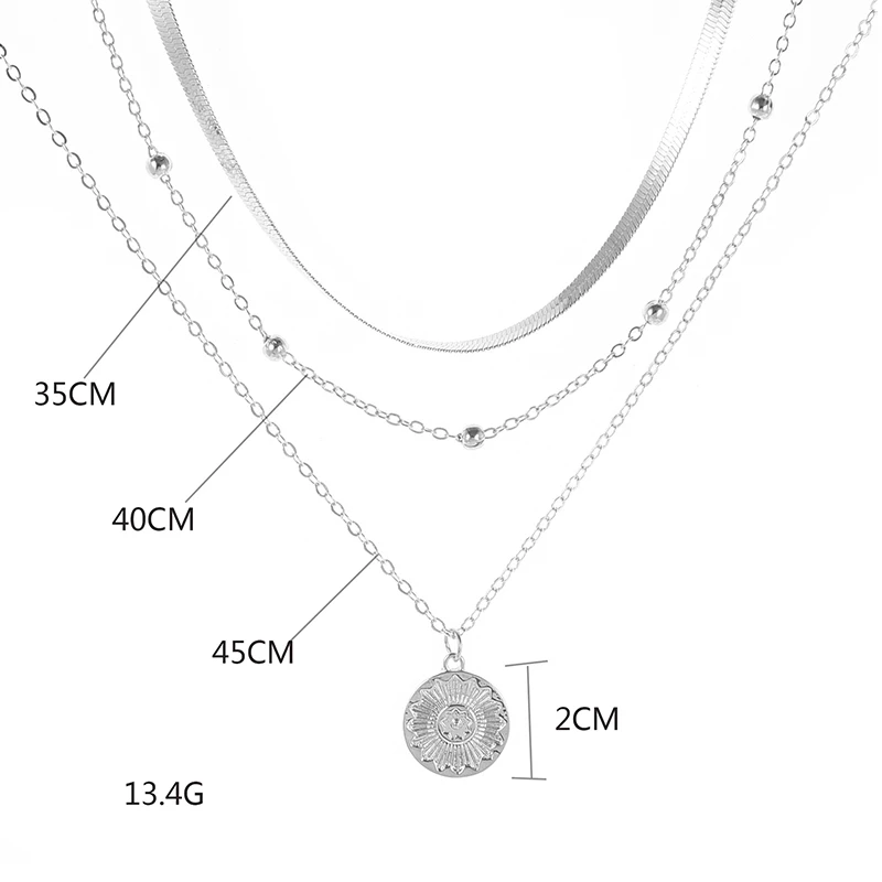 Women's elegant silver triple chain necklace, a beautiful sterling silver jewelry piece.