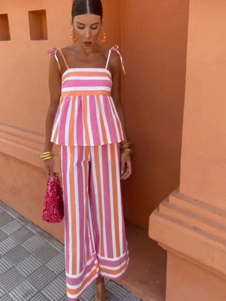 Chic women's two-piece striped wide leg set with cami top & peplum trousers, perfect for wedding guests.