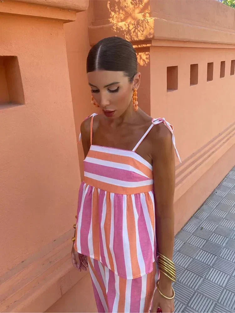 Women's elegant striped wide leg two-piece set for summer resort wear or a chic wedding guest outfit.