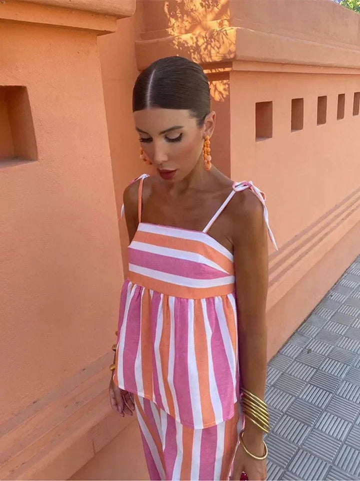 Women's elegant striped wide leg two-piece set for summer resort wear or a chic wedding guest outfit.