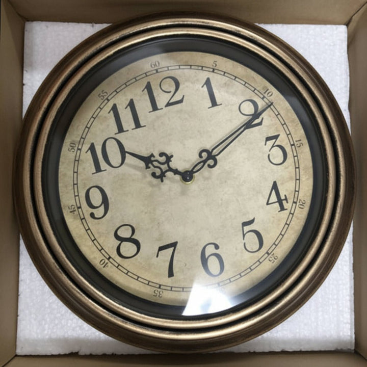 Stylish silent wall clock, a timeless home decor accent. Features precise quartz movement, an elegant metal frame & glass.