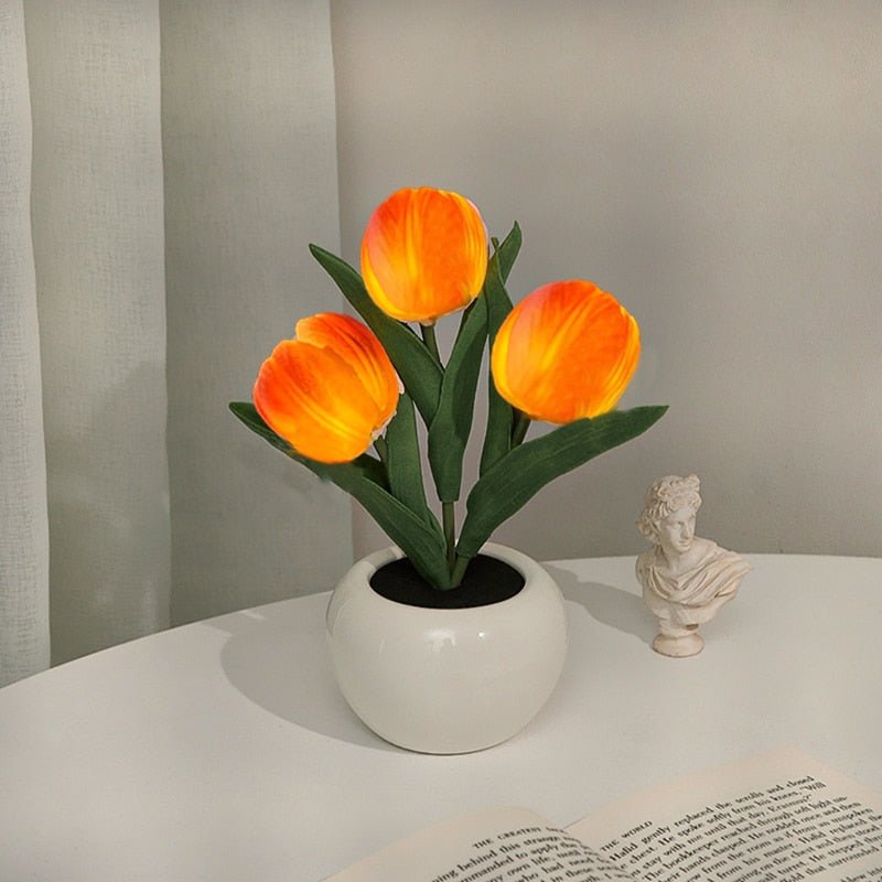 Compact LumiTulip LED light, a beautiful flower night lamp, fits perfectly on a bedside table.