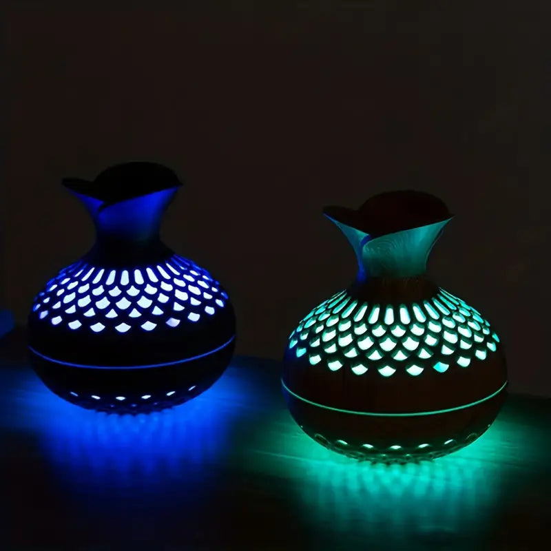 Modern USB-powered aroma diffuser for office decor, delivering therapeutic essential oil fragrances.