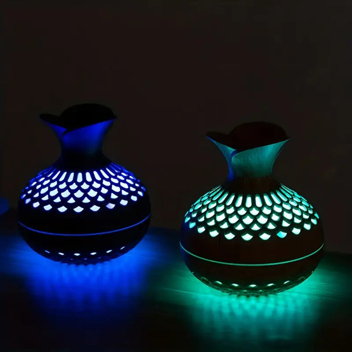 Modern USB-powered aroma diffuser for office decor, delivering therapeutic essential oil fragrances.