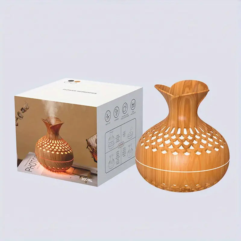 Contemporary ultrasonic aroma diffuser offering ambient mist and soothing scents for home or office.