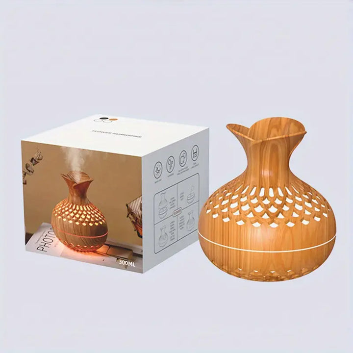 Contemporary ultrasonic aroma diffuser offering ambient mist and soothing scents for home or office.