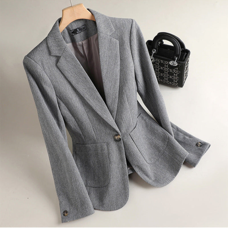 Modern tailored brown blazer for unisex business professionals. A stylish, elegant workwear jacket.