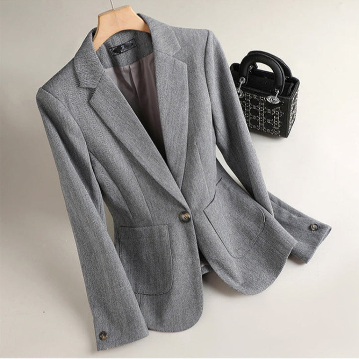 Modern tailored brown blazer for unisex business professionals. A stylish, elegant workwear jacket.