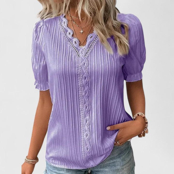 Relaxed fit women's V-neck blouse, modern design with hollow short sleeves for everyday comfort.