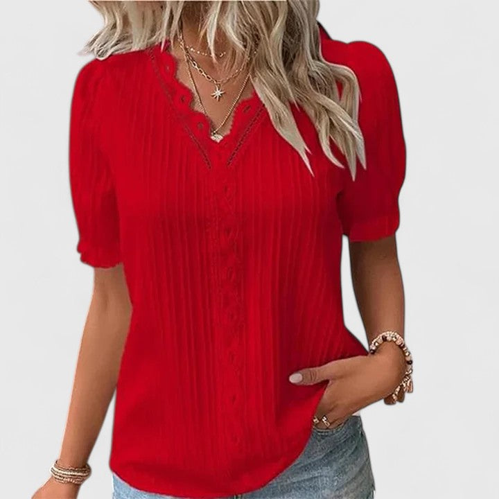 Elegant V-neck women's blouse with hollow short sleeves, offering a relaxed fit for modern everyday style.