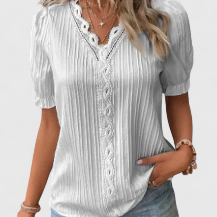 Modern women's V-neck top with hollow short sleeves, elegant & casual chic for summer vacation wear.