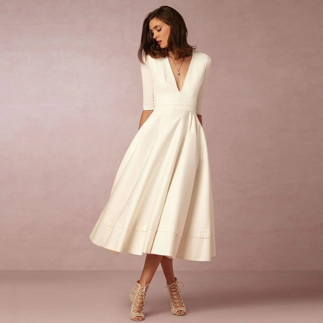 Elegant V-neck elbow-sleeve midi dress for women, offering versatile fashion & timeless style.