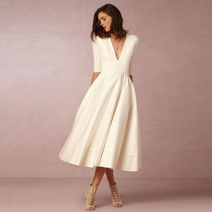 Elegant V-neck elbow-sleeve midi dress for women, offering versatile fashion & timeless style.